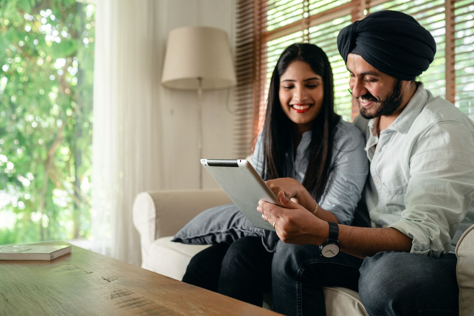 Indian professional couple reviewing plans together at home